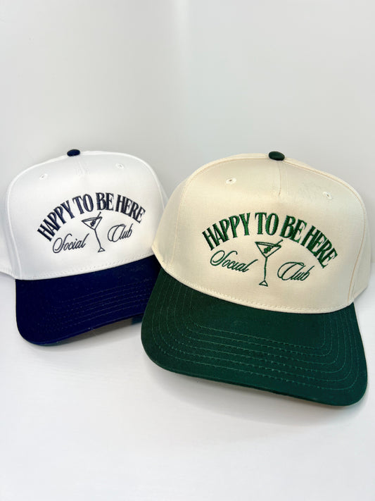 ‘HAPPY TO BE HERE SOCIAL CLUB’ CANVAS TRUCKER HAT—Drk. Green