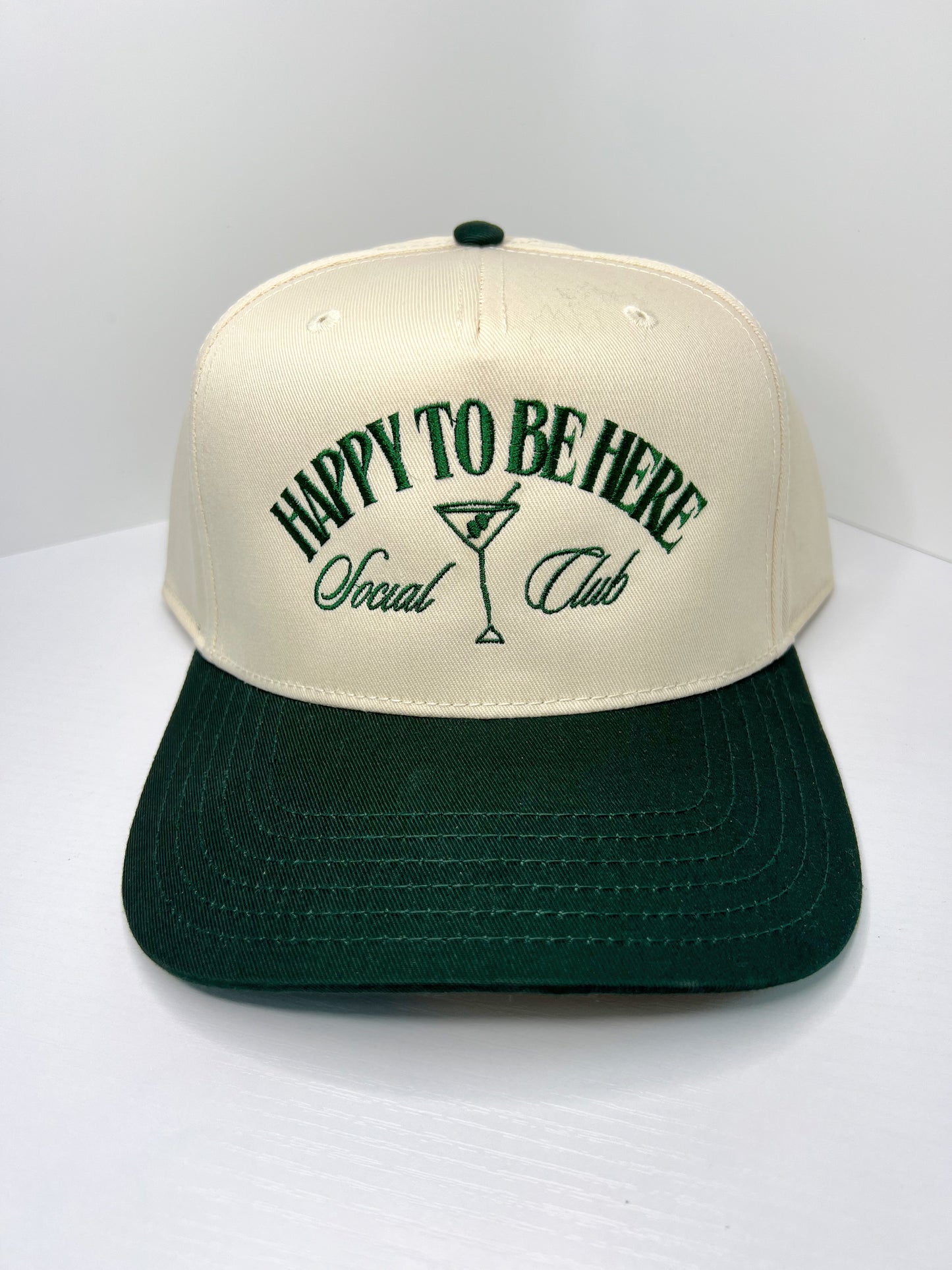 ‘HAPPY TO BE HERE SOCIAL CLUB’ CANVAS TRUCKER HAT—Drk. Green